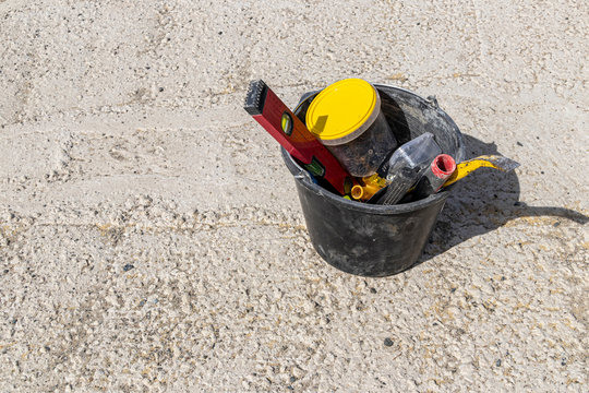 Image of construction tools in a bucket