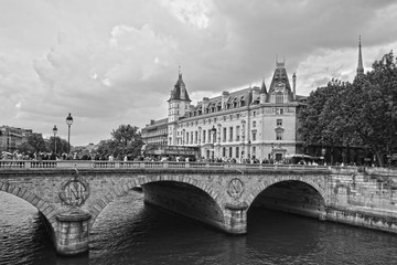 Fototapeta na wymiar Paris,France-25.05.2019:Bridge Saint Michel and Castle Conciergerie(former royal palace.Conciergerie located on west of the Cite Island and it is part of larger complex known as Palais de Justice
