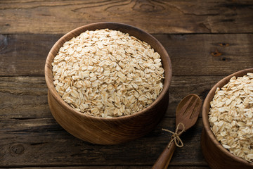 Oat flakes in glass jar and milk bottle
