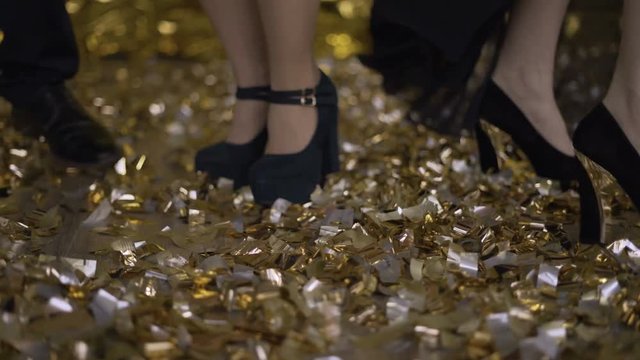 elegant legs close-up, feet in shoes dancing on the floor to the sweetie. 4K