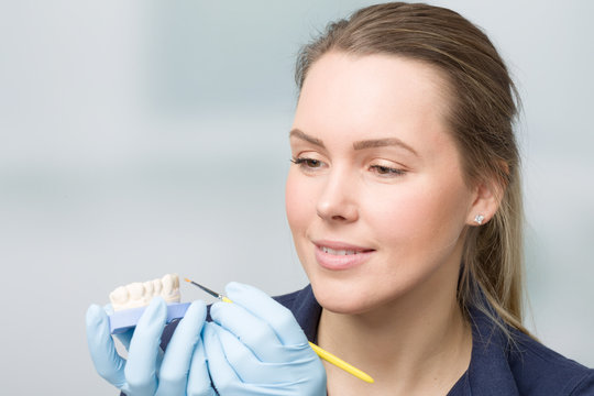 female dental technician working on artificial dention
