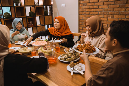Portrait hijrah family when breaking fast together in the afternoon at home