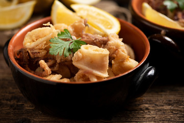 Traditional Italian fried calamari and lemon slice