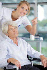 health visitor and a senior woman during home visit