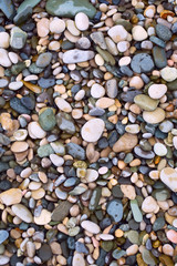 Fototapeta premium Sea stone texture. Sea wallpaper with pebbles from the coast. 