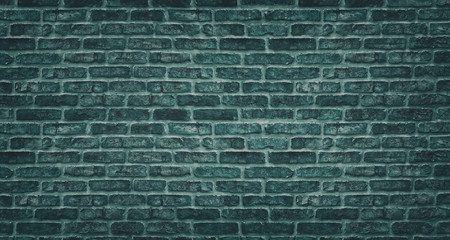 Teal brick wall texture. Dark stone block masonry. Old rough brickwork vintage background