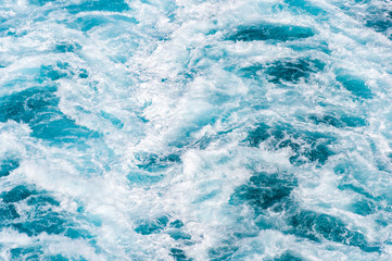 Blue sea water with foam