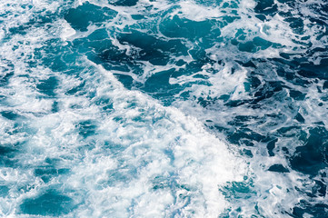 Fototapeta premium Blue sea water with foam