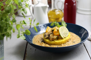 Green curry with eggplant, zucchini and celery served with yellow rice.