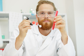 researcher at work in a laboratory with a blood pipette