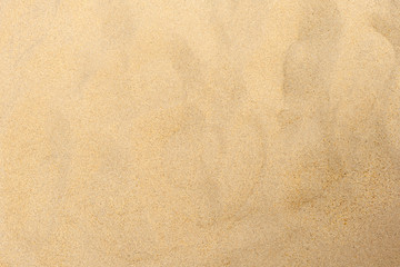 closeup of sand pattern of a beach in the summer 