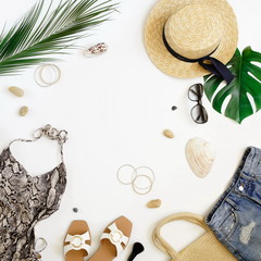 Women's summer clothes flat lay, top view. swimsuit, straw hat , sunglasses, accessories on white...