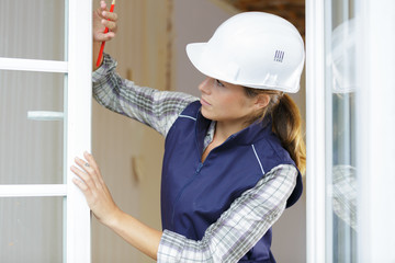 female worker by open pvc windows