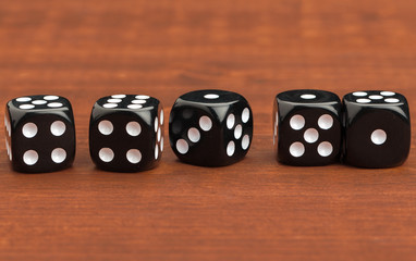 Dice on a wooden table. Concept for business risk.