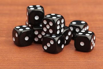 Dice on a wooden table. Concept for business risk.