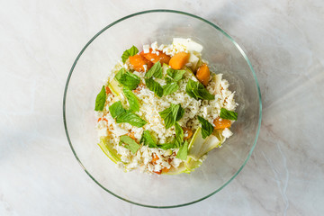 Zucchini and Apricot Salad with Cheese and Mint Leaves Ready to Mix Before Eat.