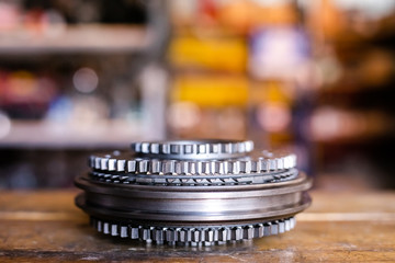 Mechanic repairs old motor of truck in a car repair station. Disassemble engine block vehicle. New details for motor. Car service concept
