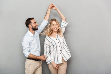 Photo closeup of joyful couple in casual clothing smiling and dancing