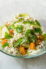 Zucchini and Apricot Salad with Cheese and Mint Leaves Ready to Mix Before Eat.
