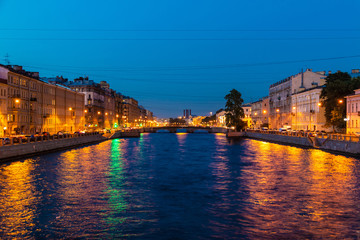 Fototapeta na wymiar Beautiful night view of the Fontanka River and historic buildings from the Krasnoarmeyskiy bridge, Saint Petersburg, Russia