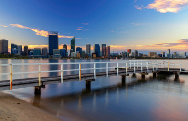 Fototapeta premium Fishing Jetty at Sunset with Perth City in Background at Sunset