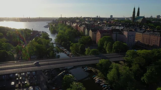 Aerial view of bridge Vasterbron and Langholmskanalen on an early summer morning with Stockholm in the backdrop 