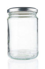 Empty glass jar close up isolated on white background