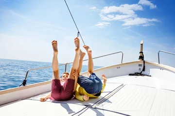 Stoff pro Meter Two little kid boys, best friends enjoying sailing boat trip. Family vacations on ocean or sea on sunny day. Children smiling. Brothers, schoolchilden, siblings having fun on yacht. © Irina Schmidt