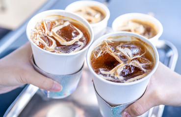 Party concept, girl with friends hold coffee cups and say cheers happy hangout together in cafe, lifestyle, copy space, top view, close up