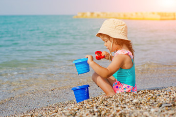 child playing on the beach