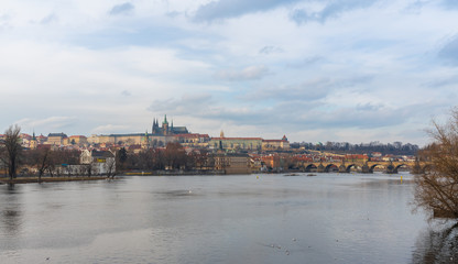 Fototapeta na wymiar Prague, Czech Republic-January 31, 2019. View of Vltava river and historical, famous Old Town at late afternoon at Winter time on January 31, 2019 in Prague City.