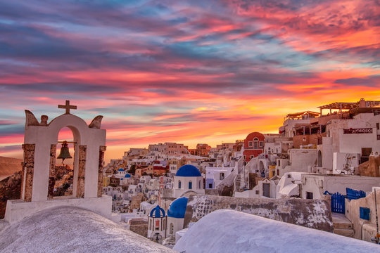 Oia village in Santorini island at sunset in Greece