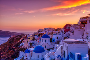 Oia village in Santorini island at sunset in Greece