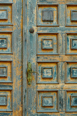 vintage wooden door and old white wall as background