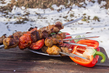 meat on skewers fried on the grill