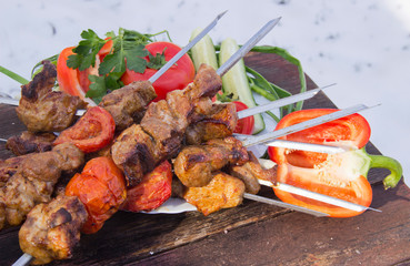 meat on skewers fried on the grill