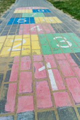 Children game hopscotch on pavement - 270393625