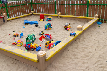 Children colorful toys in the sandbox - 270393691