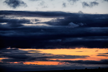 Dark stormy sky with clouds at night