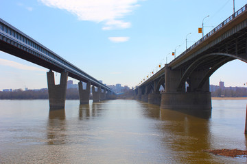 two cars bridge across the river in the city of Novosibirsk