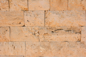 texture rough brown orange surface of an old brick wall with cracks and divorces