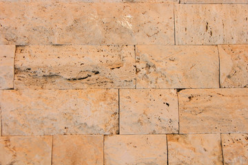 texture rough brown orange surface of an old brick wall with cracks and divorces