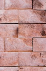 texture rough brown orange surface of an old brick wall with cracks and divorces