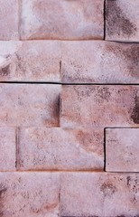 texture rough brown orange surface of an old brick wall with cracks and divorces