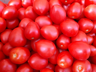 Closeup surface of tomato heap . Texture. Background. Vegetables.