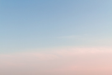 Beautiful sunset sky with feathery pink clouds in spring