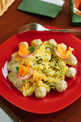 Delicious fusilli pasta with meatballs and cheese.