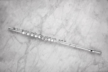 transverse flute and  rest on a marble table with copy space for your text © Andrea