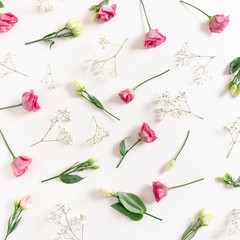 Pattern made of eustoma and gypsophila flowers on white background