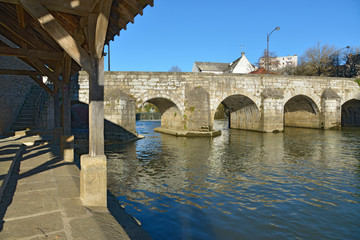 Fototapeta premium Old bridge and wash house on the Sarthe at Alençon of the Lower Normandy region in France